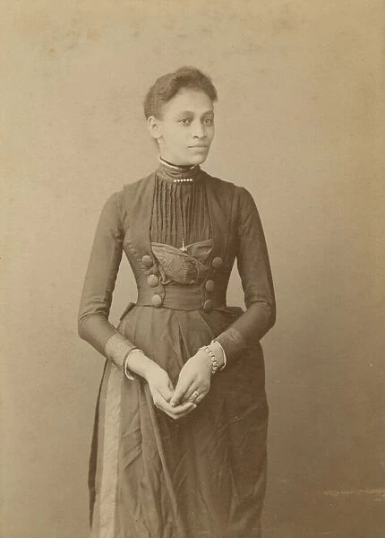 Cabinet card of a woman, 1885-1892. Creator: William J. Kuebler