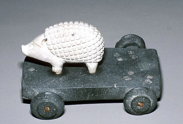 Calcite and bitumen hedgehog mounted on wheeled base, Susa, c12th century BC
