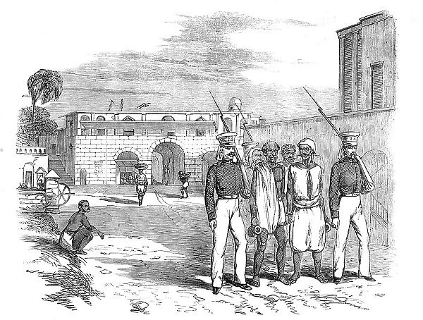 Calcutta Gate and Main Guard, Fort William: Native Prisoners under Escort, 1857. Creator: Unknown