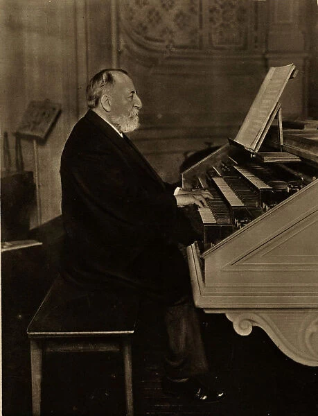 Camille Saint-Saens (1835-1921) at the Organ, 1913. Creator: Anonymous