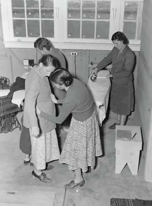 Framed Print : Camper receives help in fitting a coat from WPA sewing instructor, FSA, California, 1938. Creator: Dorothea Lange Framed Print : Camper receives help in fitting a coat from WPA sewing instructor, FSA, California, 1938. Creator: Dorothea Lange