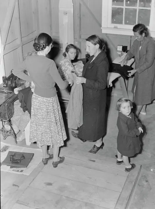 Framed Print : Camper receives help in fitting a coat from WPA sewing instructor, FSA, California, 1938. Creator: Dorothea Lange Framed Print : Camper receives help in fitting a coat from WPA sewing instructor, FSA, California, 1938. Creator: Dorothea Lange