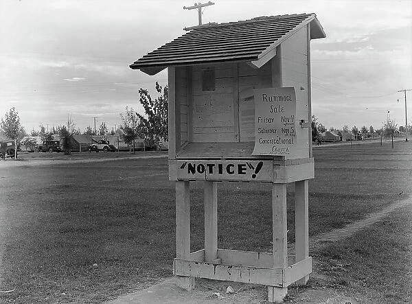Campers bulletin board near entrance of Shafter camp for migrant workers, California, 1938. Creator: Dorothea Lange