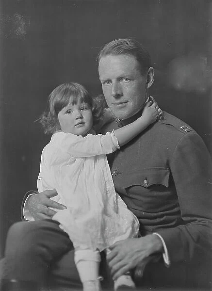 Captain Rainsforth and baby, portrait photograph, 1918 Oct. 21. Creator: Arnold Genthe
