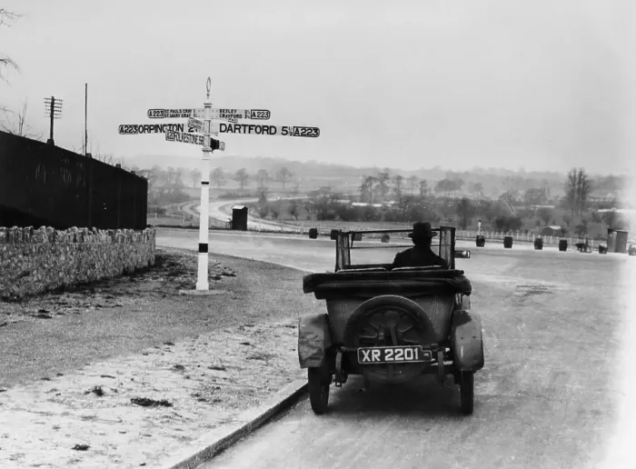 Framed Print : Car near a road sign, Bromley, Kent, 1920s Framed Print : Car near a road sign, Bromley, Kent, 1920s