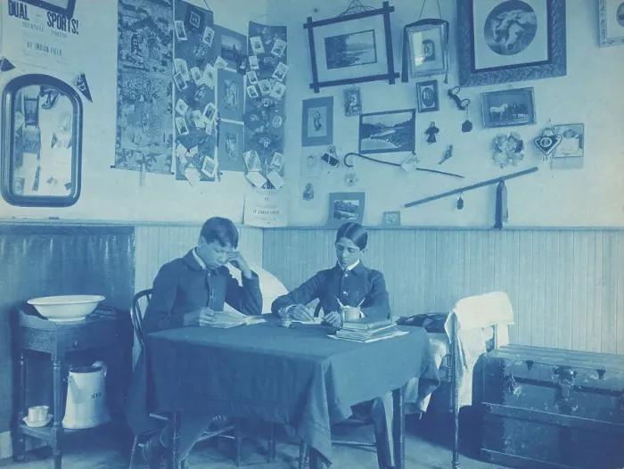 Framed Print : Carlisle Indian School, Carlisle, Pa. Two boys studying in dormitory room, 1901. Creator: Frances Benjamin Johnston Framed Print : Carlisle Indian School, Carlisle, Pa. Two boys studying in dormitory room, 1901. Creator: Frances Benjamin Johnston