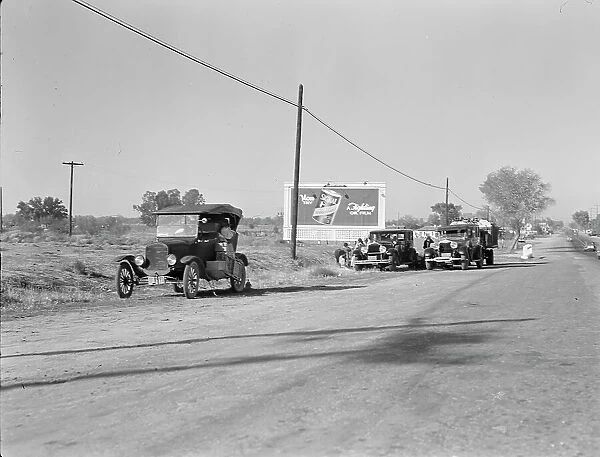 Three carloads of Mexicans headed for the Imperial Valley to harvest peas, near Bakersfield, CA, 1936 Creator: Dorothea Lange