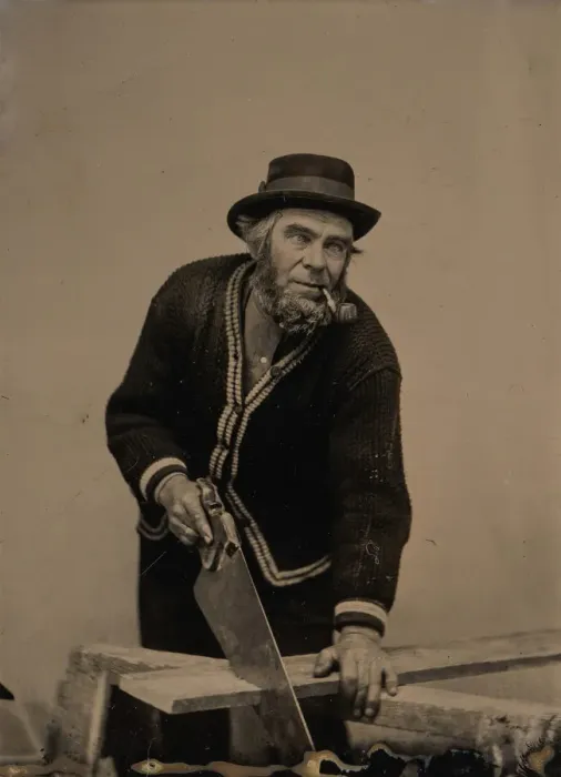 Framed Print : Carpenter Sawing a Plank of Wood, 1880s-90s. Creator: Unknown Framed Print : Carpenter Sawing a Plank of Wood, 1880s-90s. Creator: Unknown