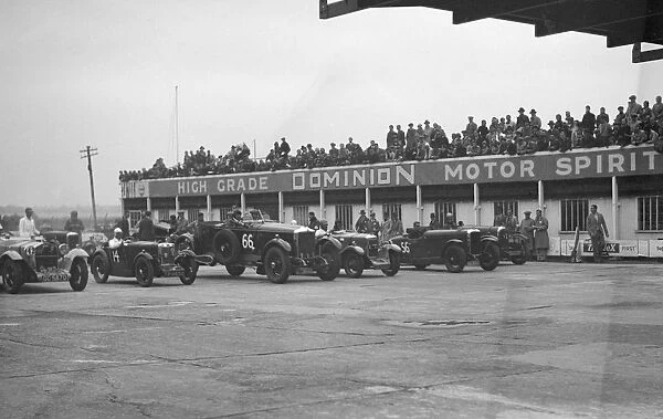 Cars at the start of a race at a JCC Meeting, Brooklands. Artist: Bill Brunell