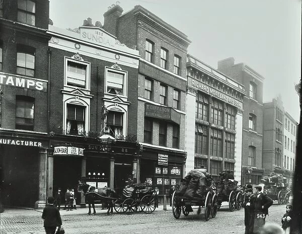 Carts outside the Sundial public house, Goswell Road, London, 1900