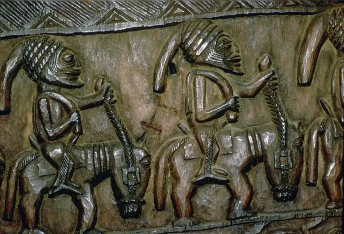 Framed Print : A carved wooden door from Nigeria depicting men on horseback Framed Print : A carved wooden door from Nigeria depicting men on horseback