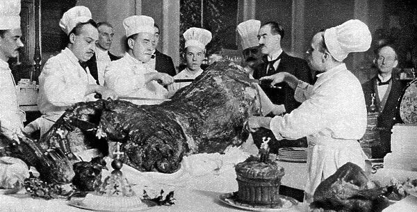 Carving a side of beef at the annual banquet at the Guildhall, London, 1926-1927