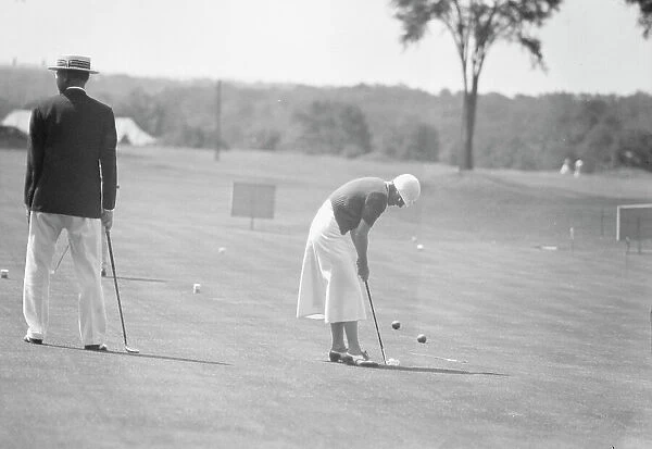 Cassidy, Ellen, Mrs. playing golf, 1932 July. Creator: Arnold Genthe