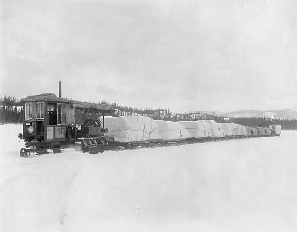 Caterpillar hauling freight on the lake in spring to the Yukon, between c1900 and c1930. Creator: Unknown