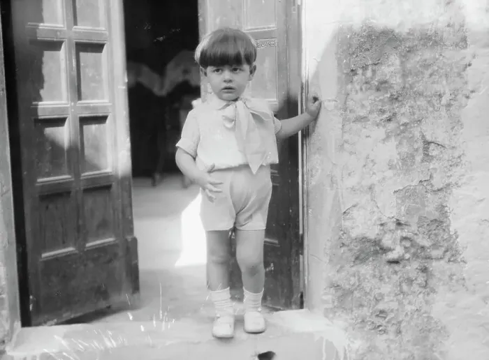 Framed Print : Cenerini, Mr. child of, standing in a doorway, 1929 Creator: Arnold Genthe Framed Print : Cenerini, Mr. child of, standing in a doorway, 1929 Creator: Arnold Genthe