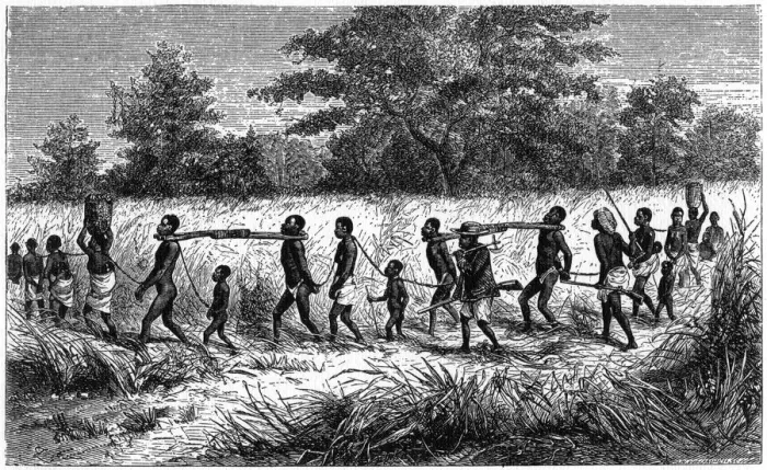 Framed Print : Chained and yoked slaves on the march to the trading station, 1965 Framed Print : Chained and yoked slaves on the march to the trading station, 1965
