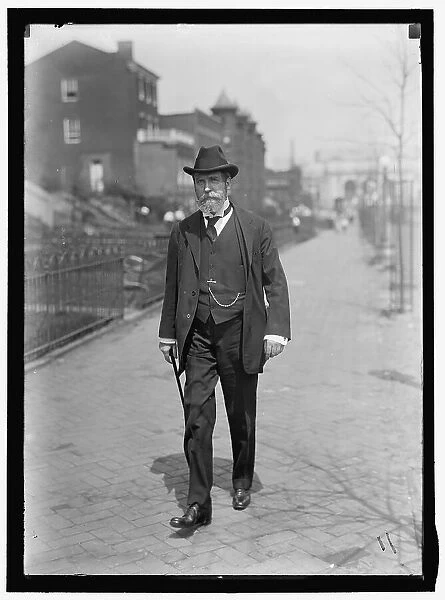 Charles Evans Hughes walking away from Union Station, Washington, D.C... between 1913 and 1917. Creator: Harris & Ewing. Charles Evans Hughes walking away from Union Station, Washington, D.C... between 1913 and 1917. Creator: Harris & Ewing