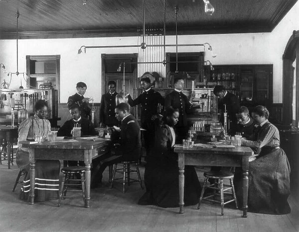 Chemistry classroom at Hampton Institute - African American male and female students, 1899 or 1900. Creator: Frances Benjamin Johnston