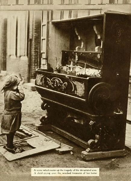 Child with damaged piano after an air raid made her homeless, First World War, 1918, (1935)
