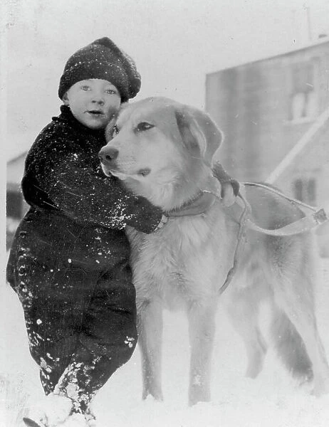 Child with dog, between c1900 and c1930. Creator: Unknown