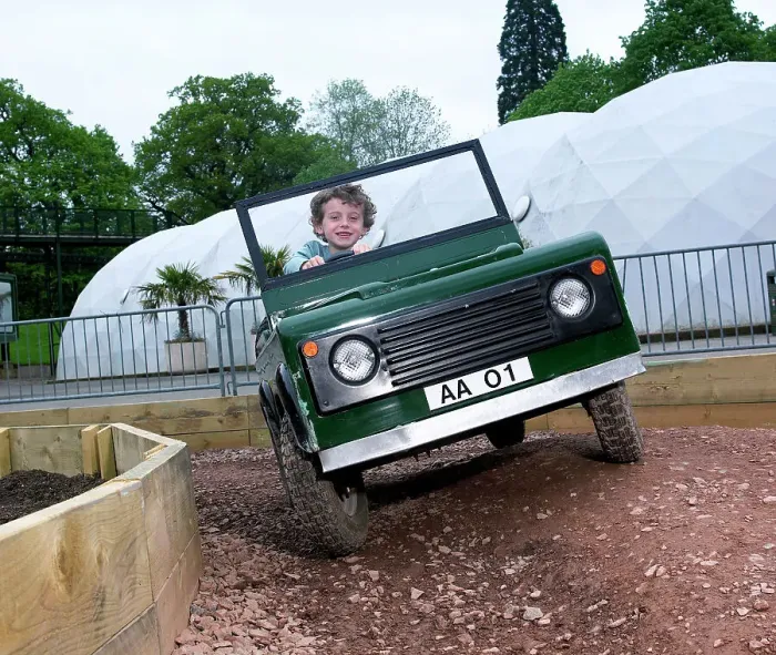 Framed Print : Child driving a toy Land Rover Framed Print : Child driving a toy Land Rover