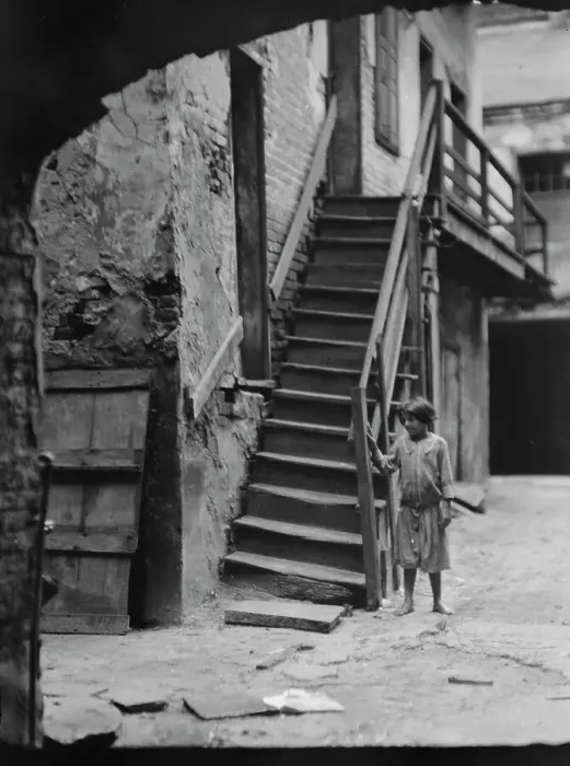 Framed Print : Child standing next to a stairway in a courtyard, New Orleans, between 1920 and 1926. Creator: Arnold Genthe Framed Print : Child standing next to a stairway in a courtyard, New Orleans, between 1920 and 1926. Creator: Arnold Genthe