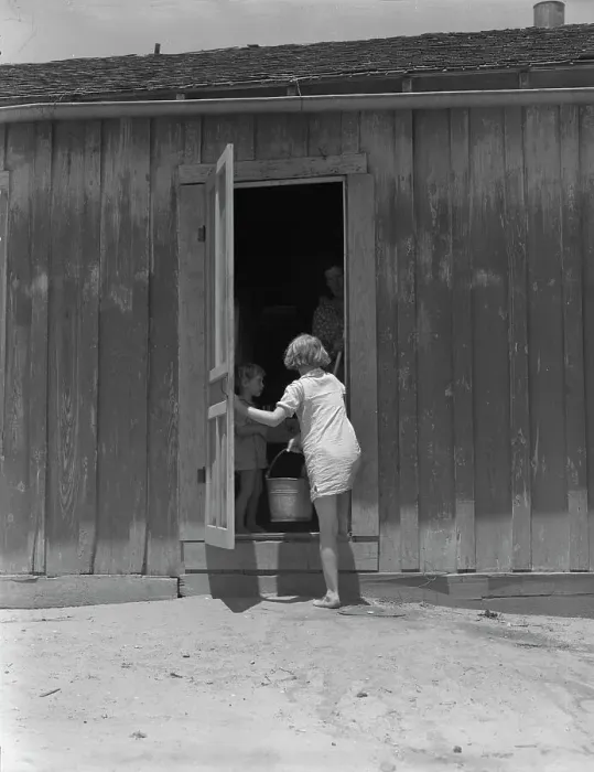 Framed Print : Child of Texas sharecropper carrying water, 1937. Creator: Dorothea Lange Framed Print : Child of Texas sharecropper carrying water, 1937. Creator: Dorothea Lange