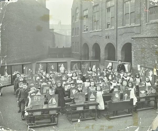 Children displaying their drawings, Flint Street School, Southwark, London, 1908