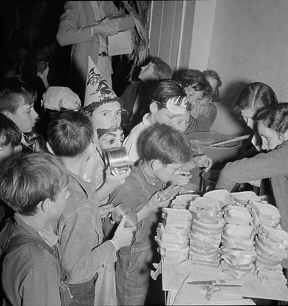 The children at Halloween party in Shafter migrant camp, California, 1938. Creator: Dorothea Lange