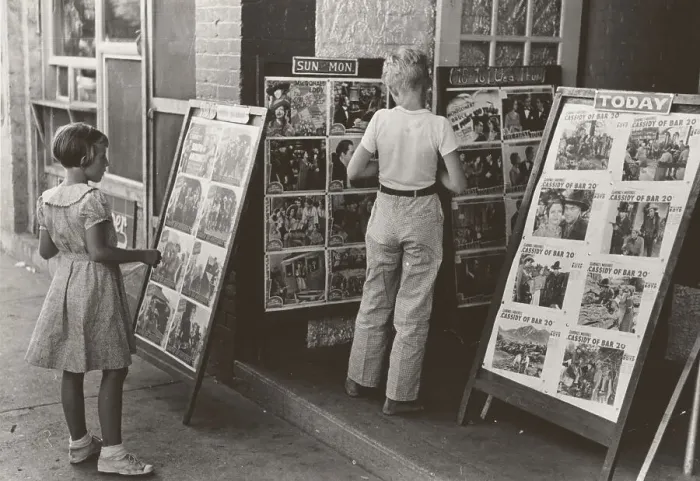 Framed Print : Children looking at posters in front of movie, Saturday, Steele, Missouri, 1938-08. Creator: Russell Lee Framed Print : Children looking at posters in front of movie, Saturday, Steele, Missouri, 1938-08. Creator: Russell Lee