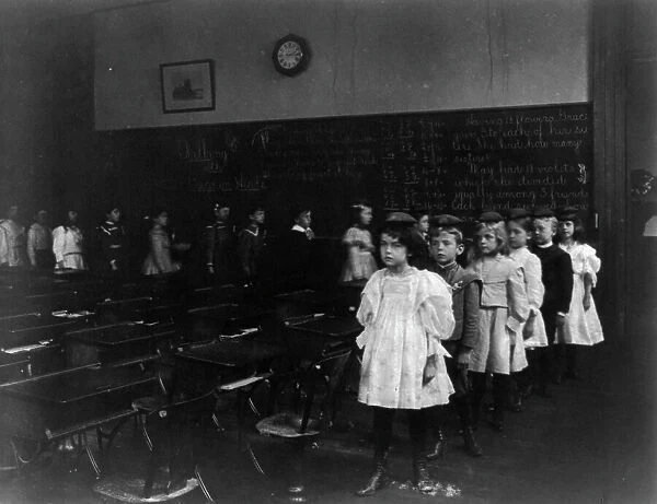 Children marching around the classroom, Washington, D.C. (1899?). Creator: Frances Benjamin Johnston