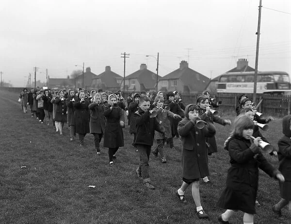 Children marching with home made bugles, Middlesborough, Teesside, 1964