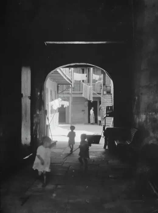 Framed Print : Children playing in an arched passageway, New Orleans, between 1920 and 1926. Creator: Arnold Genthe Framed Print : Children playing in an arched passageway, New Orleans, between 1920 and 1926. Creator: Arnold Genthe