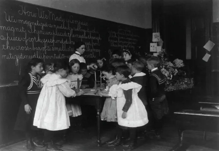 Framed Print : Children in school in Washington, D.C. - learning how a compass is made, (1899?). Creator: Frances Benjamin Johnston Framed Print : Children in school in Washington, D.C. - learning how a compass is made, (1899?). Creator: Frances Benjamin Johnston