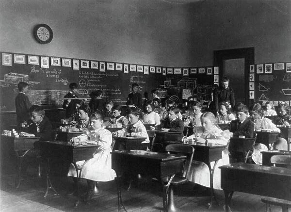 Children in school in Washington, D.C. - studying geometry, (1899?). Creator: Frances Benjamin Johnston