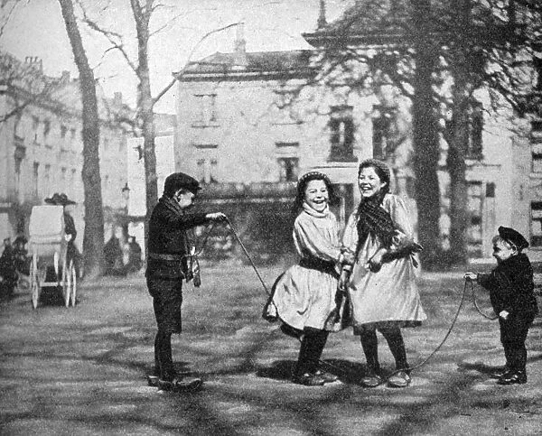 Children skipping in the Grand Place, Bruges, Belgium, 1922. Artist: FC Davis