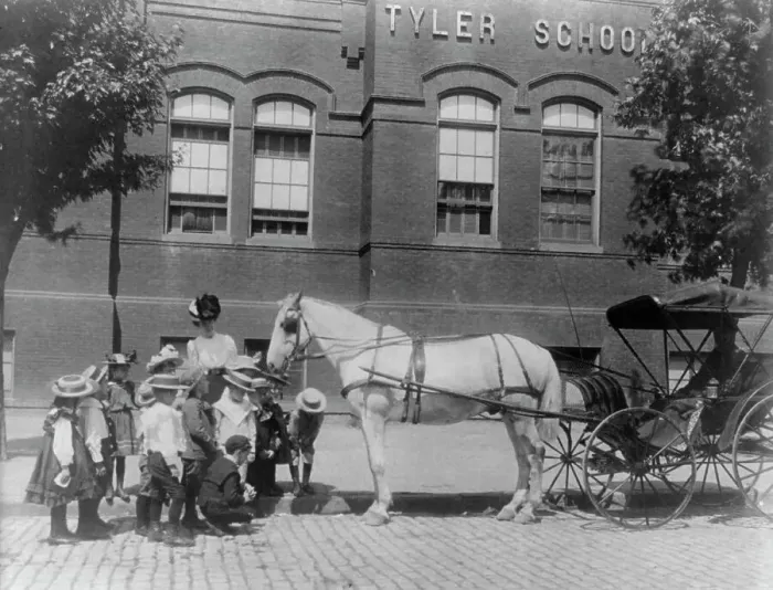 Framed Print : Children studying a horse and buggy outside the Tyler School, Washington, D.C. (1899?). Creator: Frances Benjamin Johnston Framed Print : Children studying a horse and buggy outside the Tyler School, Washington, D.C. (1899?). Creator: Frances Benjamin Johnston