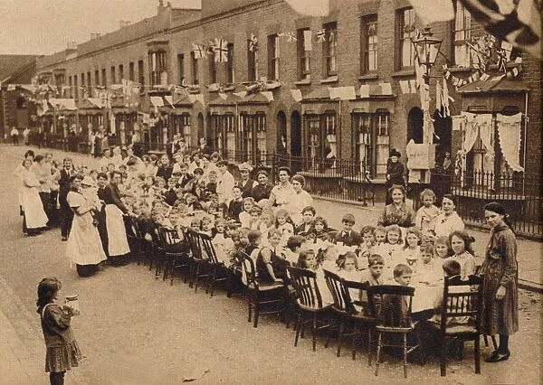 A childrens tea party in an East End Street in London, to celebrate the Treaty of Versailles at t