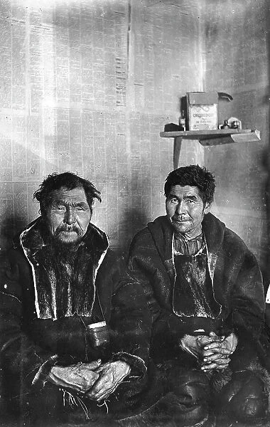 Two Chukchi in kukhlyankas, 1910-1929. Creator: Ivan Emelianovich Larin