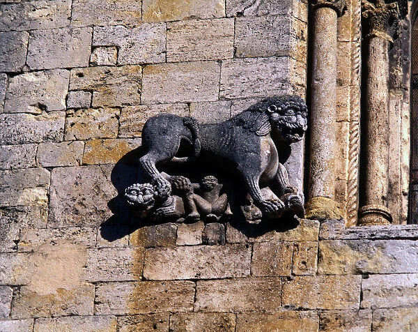 Church of San Pedro de Besalu, lion protecting a human figure and decorating the