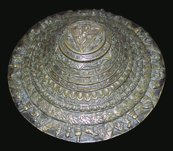 Circular plaque from Nepal with dancing figure, probably Chamunda
