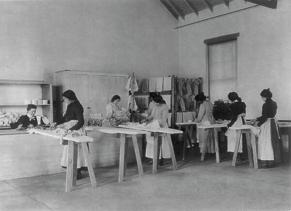 Classroom scenes at Carlisle, Pa. Indian School. Ironing; women students, 1901. Creator: Frances Benjamin Johnston