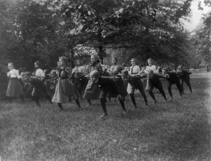 Framed Print : Classroom scenes in Washington, D.C. public schools - outdoor exercise with rods... (1899?). Creator: Frances Benjamin Johnston Framed Print : Classroom scenes in Washington, D.C. public schools - outdoor exercise with rods... (1899?). Creator: Frances Benjamin Johnston