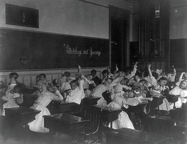 Classroom scenes in Washington, D.C. public schools - stretching and yawning exercise... (1899?). Creator: Frances Benjamin Johnston