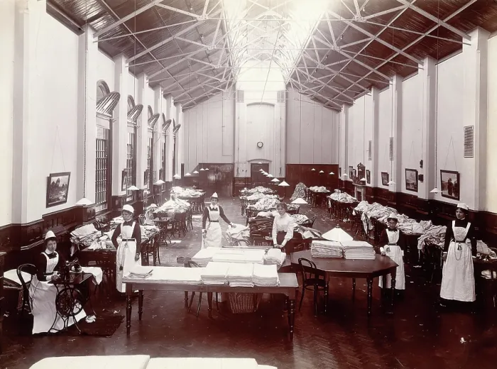 Framed Print : Claybury Asylum, Woodford, Essex: a linen room, [1893?]. Creator: London & County Photographic Co