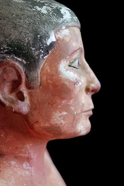 Close up of an Egyptian seated scribe model