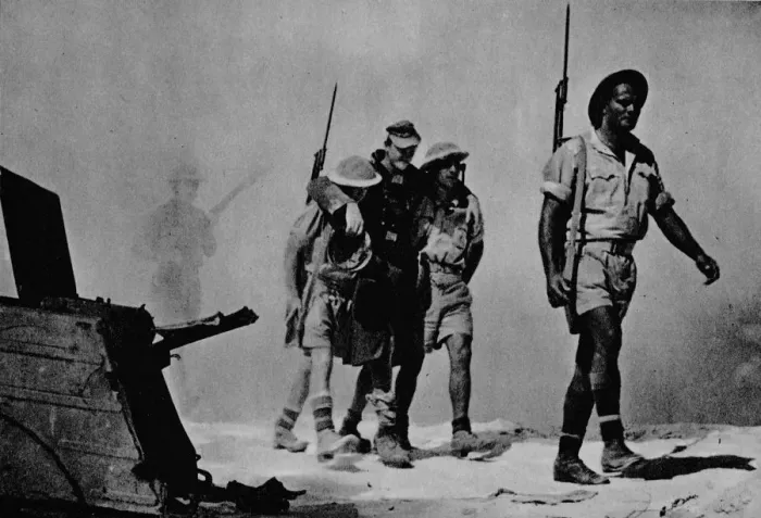 Framed Print : Close-up of a great battle. The Australians are bringing in a wounded prisoner, 1942 (1944) Framed Print : Close-up of a great battle. The Australians are bringing in a wounded prisoner, 1942 (1944)
