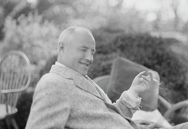 Clucas, E.W. seated outdoors, 1931 June 14. Creator: Arnold Genthe