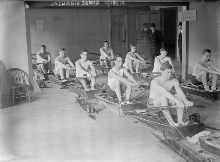 Framed Print : Columbia crew team in mock shells practicing in club house, 1910. Creator: Bain News Service