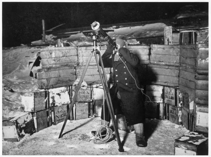Framed Print : Commander Evans observing an Occulation of Jupiter, Antarctica, 1910-1912. Artist Framed Print : Commander Evans observing an Occulation of Jupiter, Antarctica, 1910-1912. Artist